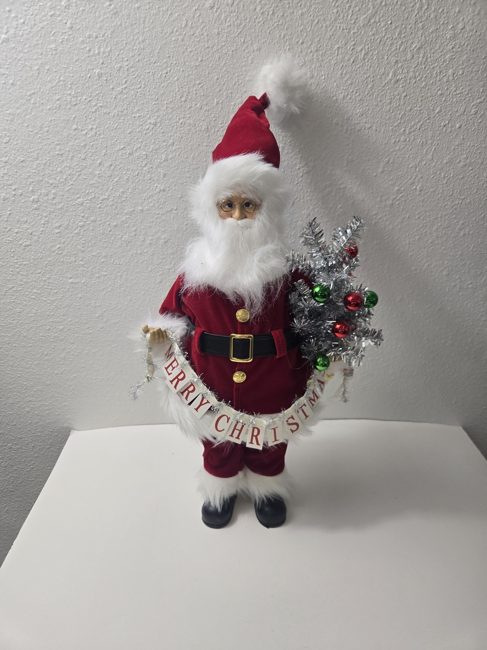 Holiday Red Santa Figurine with 'Merry Christmas' Banner
